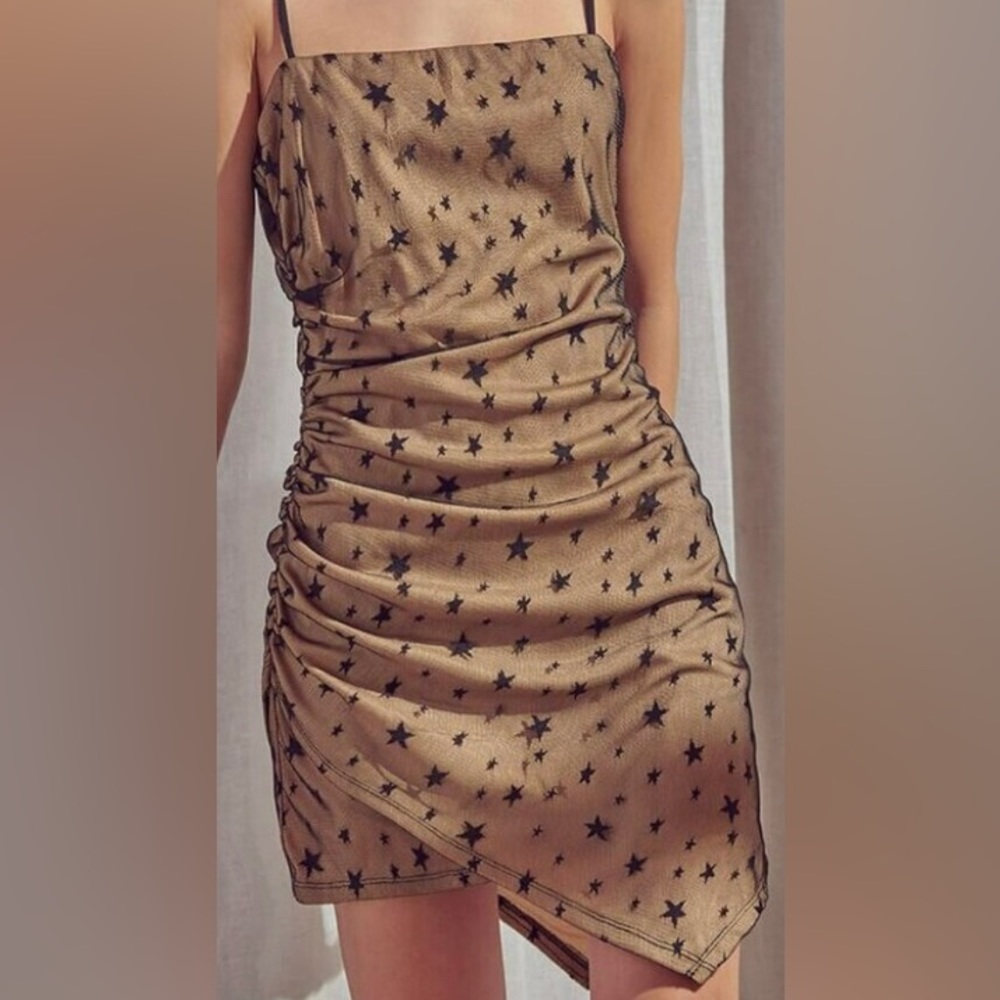 Storia embroidered star black mesh mini dress with nude lining.